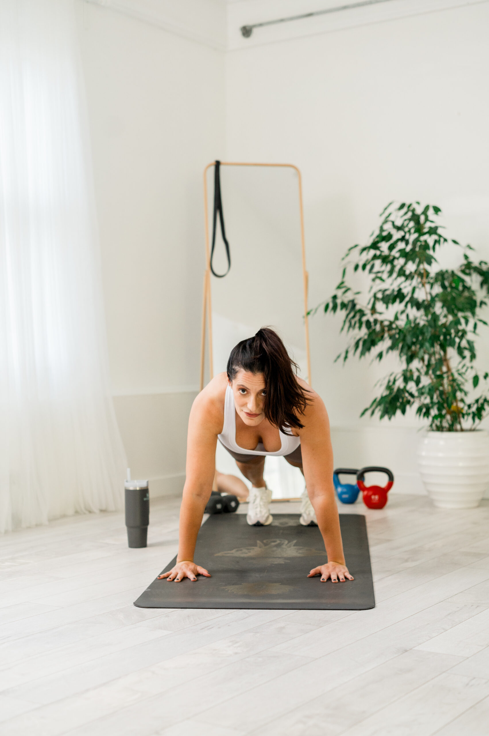 women on exercise mat in a plank