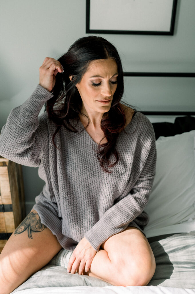 woman on bed, contemplating